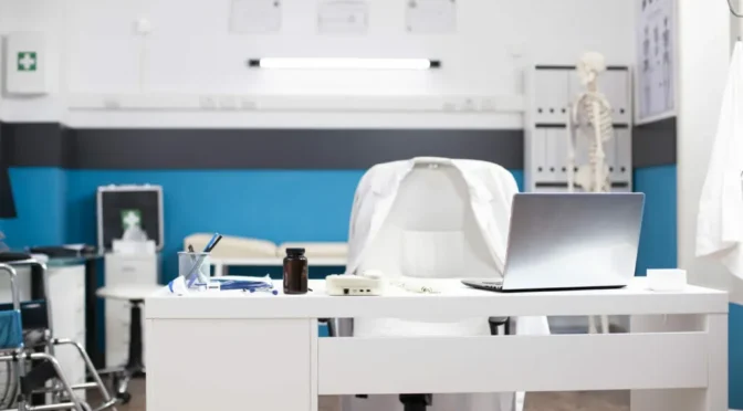 Vacant hospital room with laptop