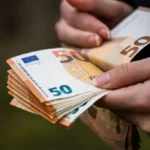 Closeup female hands counting euro banknotes world money inflation economy concept