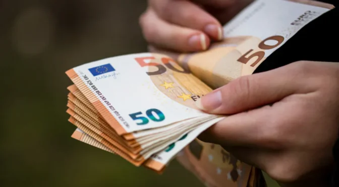 Closeup female hands counting euro banknotes world money inflation economy concept