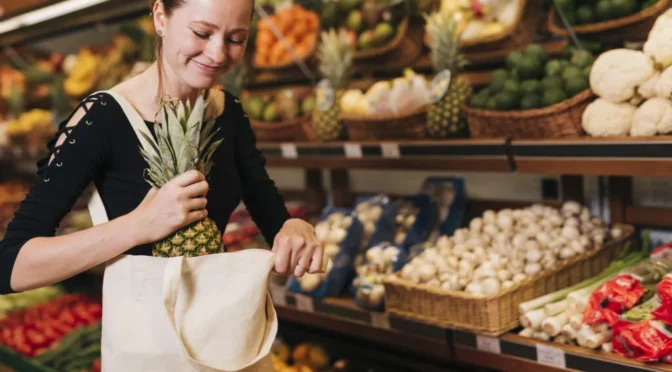 Woman putting pineapple bag